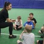 Trainer Educating gym kids